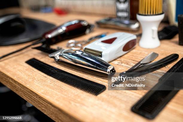 hair cutting tools and accessories on blue background with space stock photo - accessoires stock pictures, royalty-free photos & images