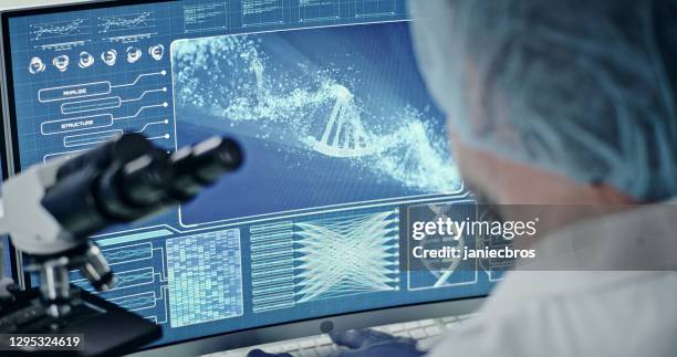 futuristic laboratory equipment. rear view of scientist during dna research. dna helix model - helix stock pictures, royalty-free photos & images