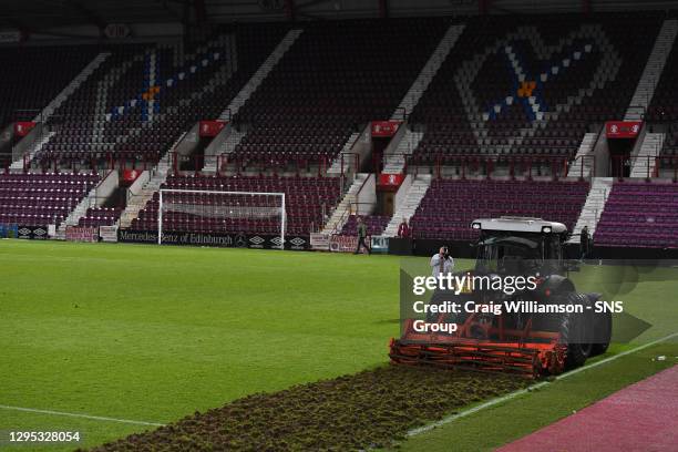 V HIBERNIAN.Hearts begin working on their pitch straight after full time ahead of next season