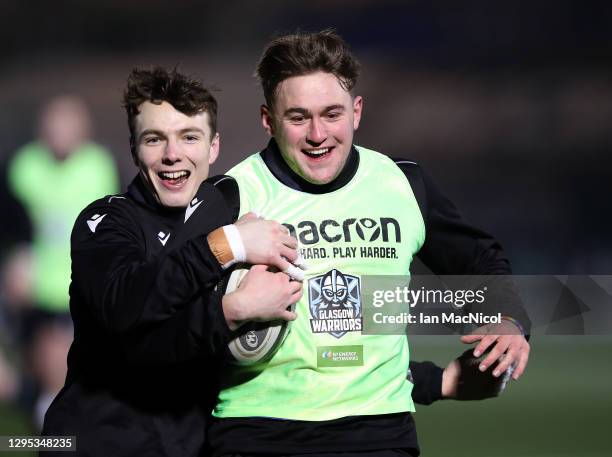 James Dobie and Ollie Smith of Glasgow Warriors play touch rugby after the Guinness Pro14 match between Glasgow Warriors and Edinburgh was abandoned...