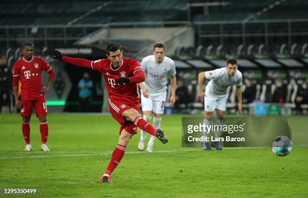 Robert Lewandowski of Bayern Munich scores their sides first goal from the penalty spot during the Bundesliga match between Borussia Moenchengladbach...