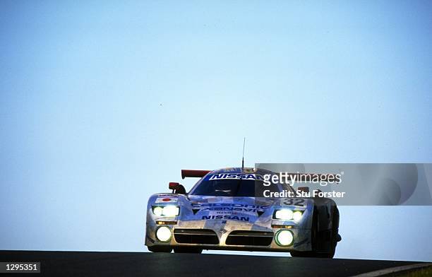 The Nissan Motorsports Nissan R390 GT1 driven by Kazuyoshi Hoshino, Aguri Suzuki and Mashiko Motoyama all of Japan in action during the Le Mans 24...