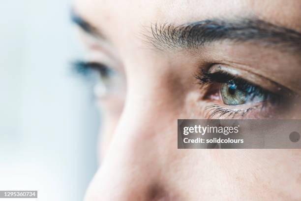 crying woman - eyes crying stock pictures, royalty-free photos & images
