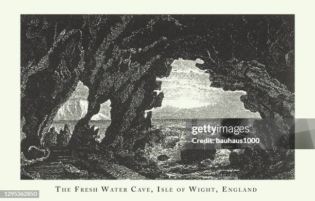 engraved antique, fresh water cave, isle of wight, england, forests, lakes, caves and unusual rock formation engraving antique illustration, published 1851 - isle of wight map stock illustrations