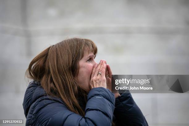 Tamy Ingvaldson shouts a prayer for peace outside the U.S. Capitol on January 08, 2021 in Washington, DC. Ingvaldson, who is from Owatonna,...