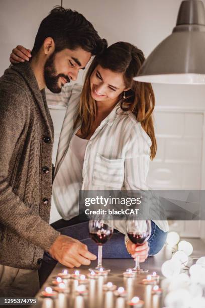 romantic night at home for a young couple - couple passion stock pictures, royalty-free photos & images