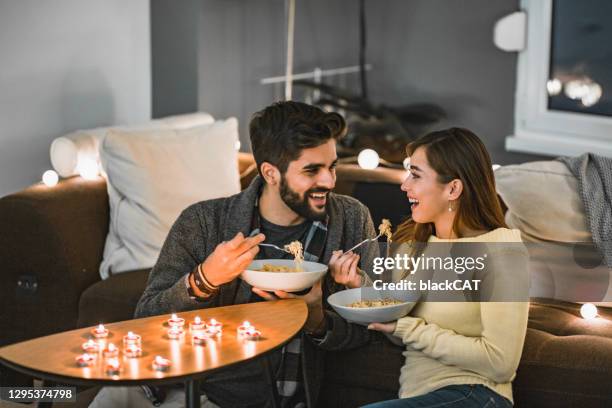 romantic and easy dinner at home - couple dinner date stock pictures, royalty-free photos & images