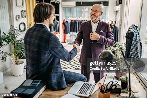 satisfied customer is best customer - menswear retail stock pictures, royalty-free photos & images