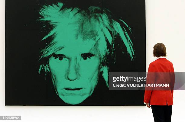 Visitor contemplates the work "Self-Portrait" by American pop artist Andy Warhol 18 July 2006 at the Art and Exhibition Hall of the Federal Republic...