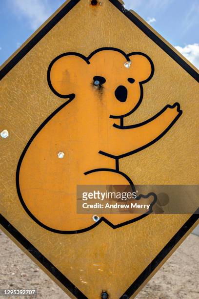 close up of koala crossing sign with bullet holes, australia - gun control icon stock pictures, royalty-free photos & images