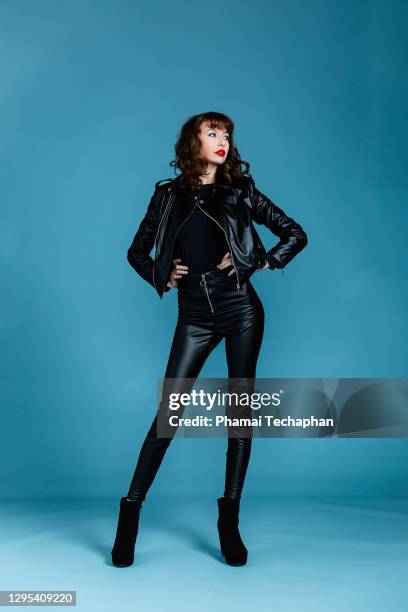 beautiful woman in leather jacket - black leather pants women stock pictures, royalty-free photos & images