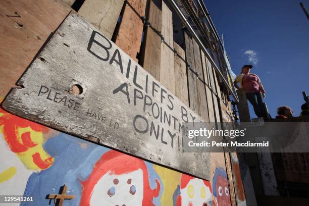 Resident stands on the barricaded front gate to Dale Farm travellers camp on October 18, 2011 in Basildon, England. Activists and residents have lost...