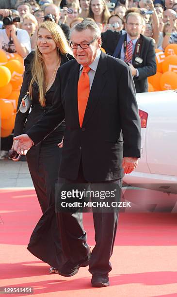 Czech born US director Milos Forman accompanied with his wife Martina walks the red carpet to attend the opening ceremony of the 44th Karlovy Vary...