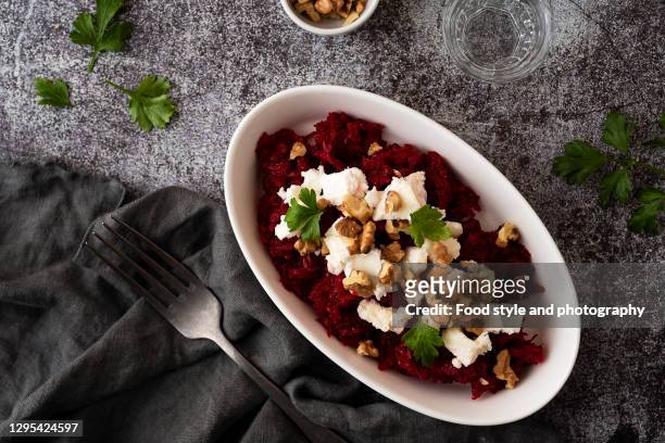 raw beetroot salad with goat cheese and roasted walnuts - chevre animal stock pictures, royalty-free photos & images