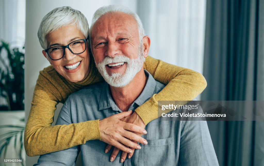 Portrait of happy smiling senior couple at home.