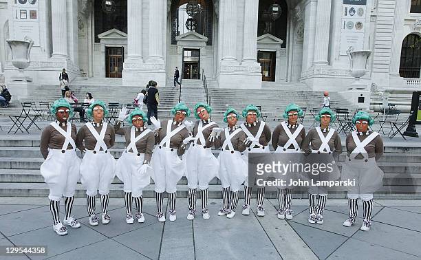 The Oompa Loompas hand out Golden Tickets for the "40th Anniversary of Willy Wonka & The Chocolate Factory" event on October 18, 2011 in New York...