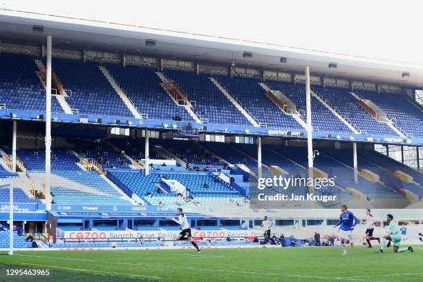 Cenk Tosun of Everton scores his team's first goal during the FA Cup Third Round match between Everton and Rotherham United at Goodison Park on...