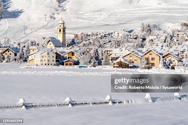 alpine village of celerina covered with snow, switzerland - st moritz stock pictures, royalty-free photos & images