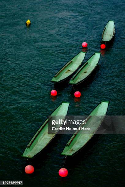 rowing boats with buoys - basel stock-fotos und bilder