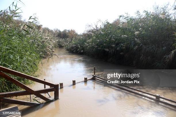 Picture shows the Jordan River where Juses Christ was baptised, while a few meters away Latin patriarch of Jerusalem, Pierrbattista Pizzaballa holds...