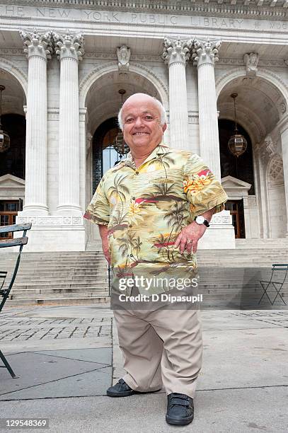 Rusty Goffe poses while Oompa Loompas hand out Golden Tickets for the "40th Anniversary of Willy Wonka & The Chocolate Factory" event on October 18,...