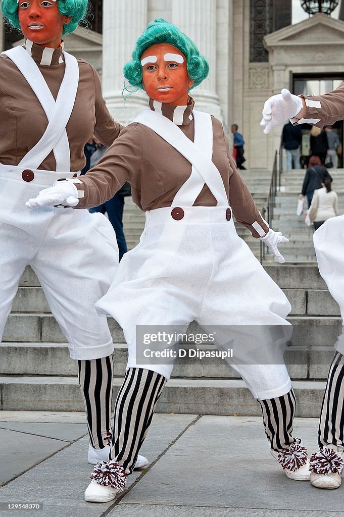 Oompa Loompas Hand Out Golden Tickets For The "40th Anniversary Of Willy Wonka & The Chocolate Factory" Event