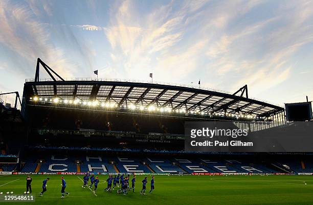General view of the KRC Genk players warming up during a KRC Genk training session ahead of the UEFA Champions League Group E match against Chelsea...