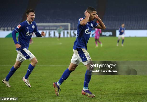 Amine Harit of FC Schalke 04 celebrates after scoring their team's fourth goal during the Bundesliga match between FC Schalke 04 and TSG Hoffenheim...