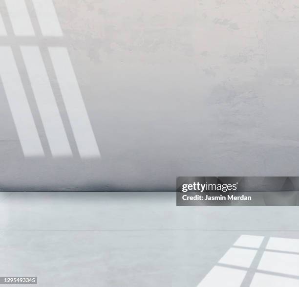 shadow and light playing on wall and ground - windows surface stock pictures, royalty-free photos & images