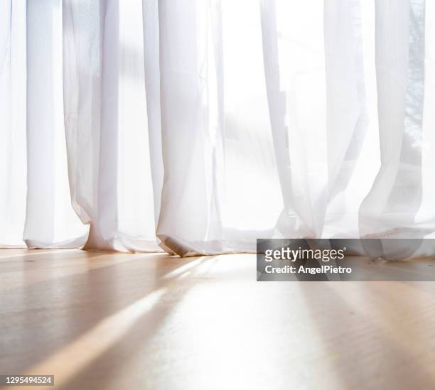 light filters through the window curtains. - translucent stock pictures, royalty-free photos & images