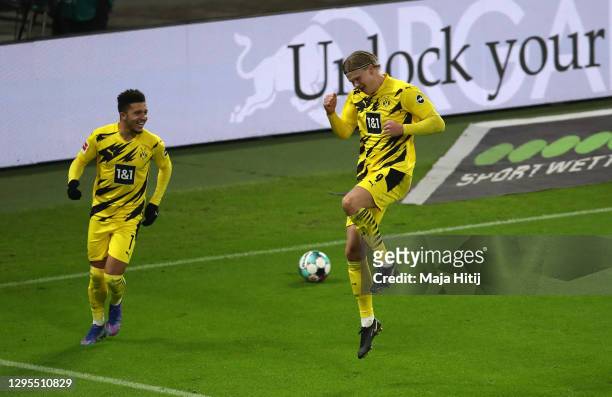 Erling Haaland of Borussia Dortmund celebrates with teammate Jadon Sancho after scoring their sides second goal during the Bundesliga match between...