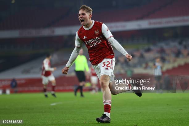 Emile Smith Rowe of Arsenal celebrates after scoring their sides first goal during the FA Cup Third Round match between Arsenal and Newcastle United...