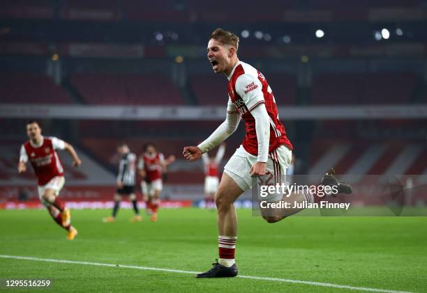 Emile Smith Rowe of Arsenal celebrates after scoring their sides first goal during the FA Cup Third Round match between Arsenal and Newcastle United...