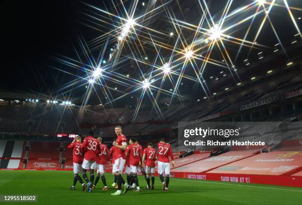 Scott McTominay of Manchester United celebrates with teammates after scoring their team's first goal during the FA Cup Third Round match between...