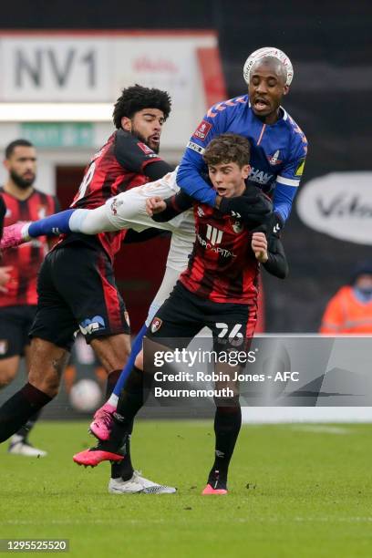 Philip Billing and Gavin Kilkenny of Bournemouth with Dylan Bahamboula of Oldham Athletic during FA Cup 3rd Round match between Oldham Athletic and...