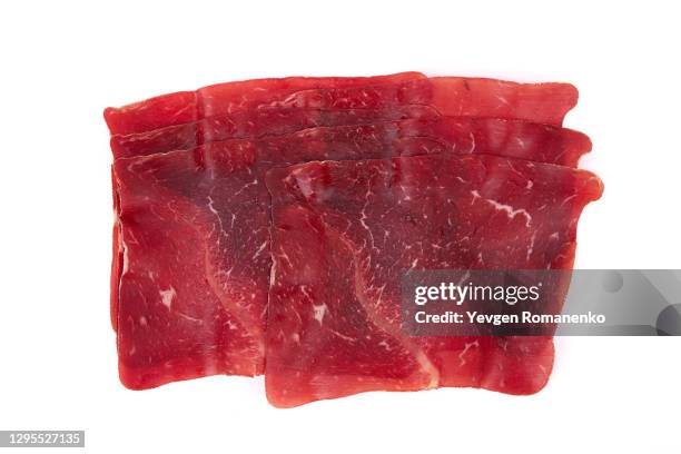 dried meat slices isolated on white background - carne di cavallo foto e immagini stock