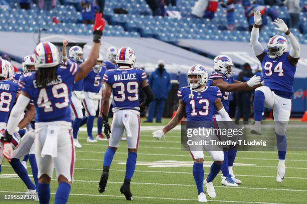 The Buffalo Bills celebrate a 27-24 win during the second half of the AFC Wild Card playoff game against the Indianapolis Colts at Bills Stadium on...