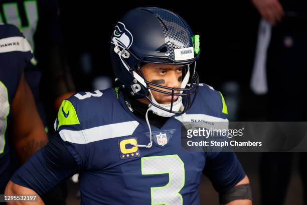 Quarterback Russell Wilson of the Seattle Seahawks leads his team onto the field to start the NFC Wild Card Playoff game against the Los Angeles Rams...
