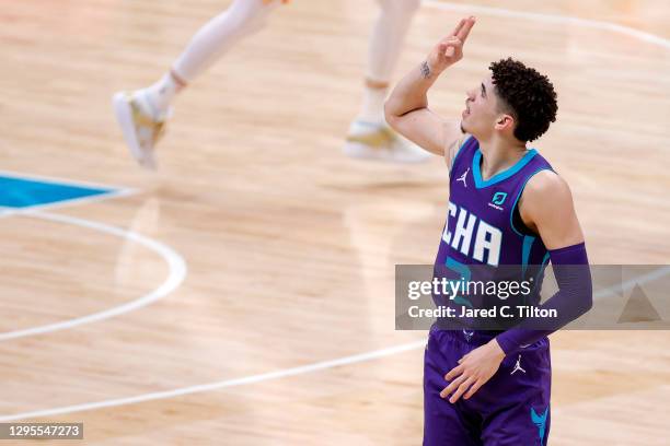 LaMelo Ball of the Charlotte Hornets reacts following a three point basket during the second quarter of their game against the Atlanta Hawks at...