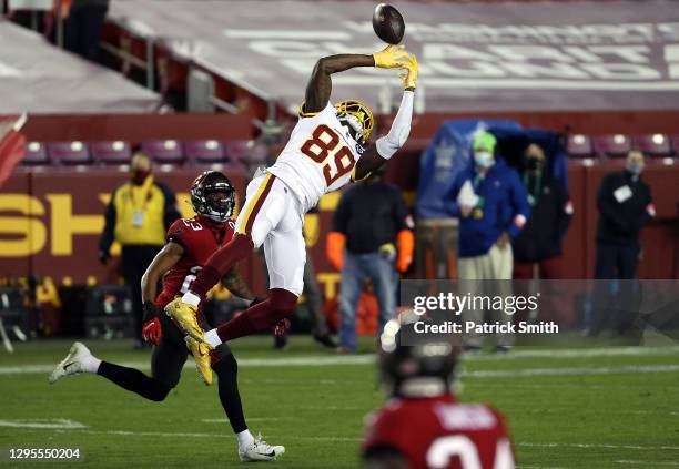 Wide receiver Cam Sims of the Washington Football Team leaps for the ball during the 1st quarter of the game against the Tampa Bay Buccaneers at...