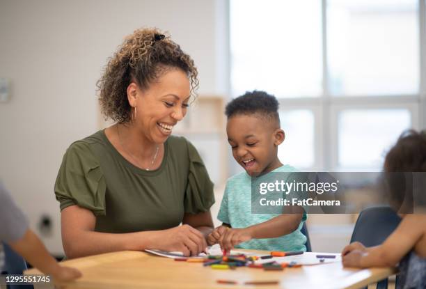 colouring together is more fun - montessori education stock pictures, royalty-free photos & images