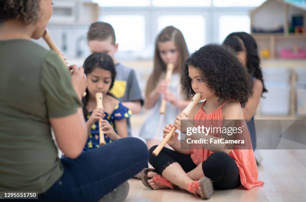 music class in preschool classroom - flauta imagens e fotografias de stock