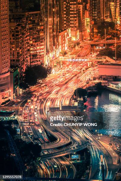 nightride - long exposure in wanchai, hong kong - car light trails stock pictures, royalty-free photos & images