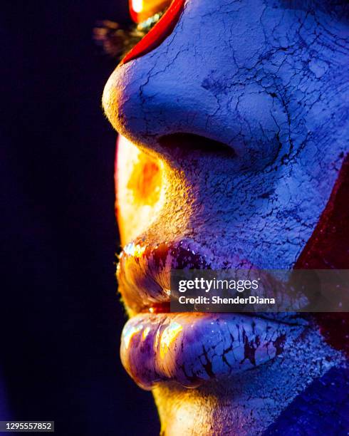 close up lips and nose under the paint with cracks in blue color - blue lips stock pictures, royalty-free photos & images