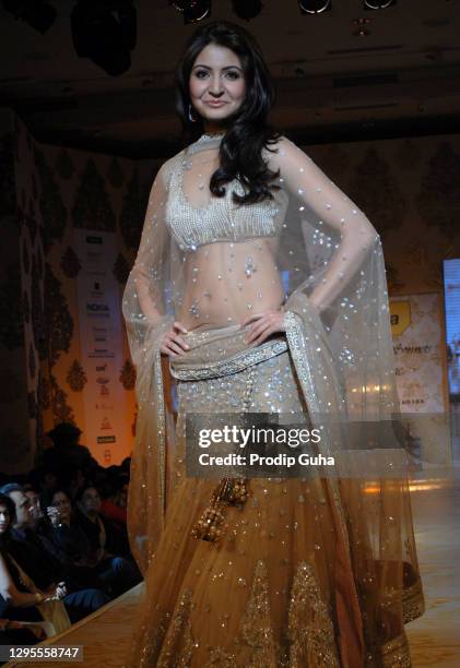 Anushka Sharma walks the ramp for designer Manish Malhotra's creation at the fundraising fashion show 'Mijwan' on January 23, 2011 in Mumbai, India.