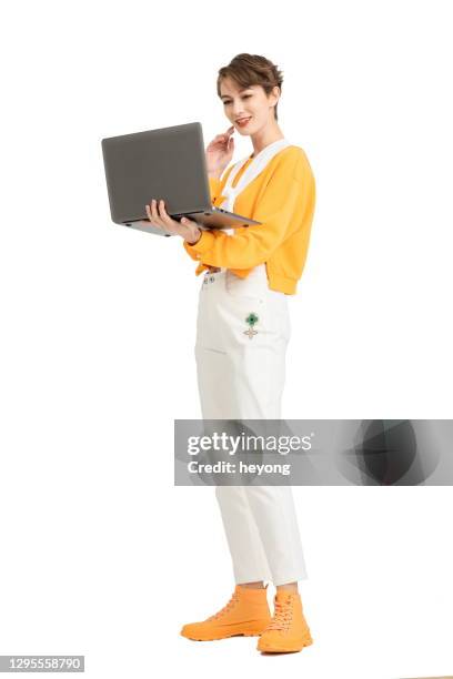 young caucasian female using laptop - design studio woman chinese laptop bildbanksfoton och bilder