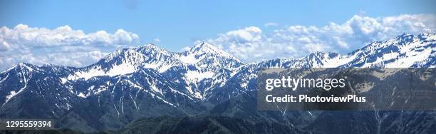 panaroma - the snow covered peaks of the wasatch mountain range - park city stock pictures, royalty-free photos & images