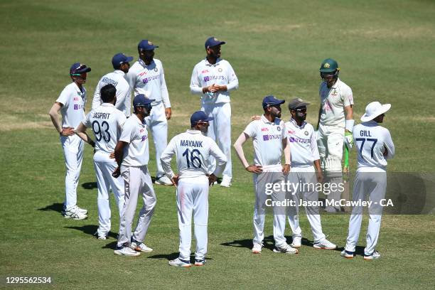 Mohammed Siraj of India and Ajinkya Rahane of India during day four of the 3rd Test match in the series between Australia and India at Sydney Cricket...