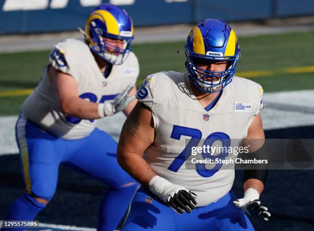 Rob Havenstein of the Los Angeles Rams warms up before the game against the Seattle Seahawks in an NFC Wild Card game at Lumen Field on January 09,...