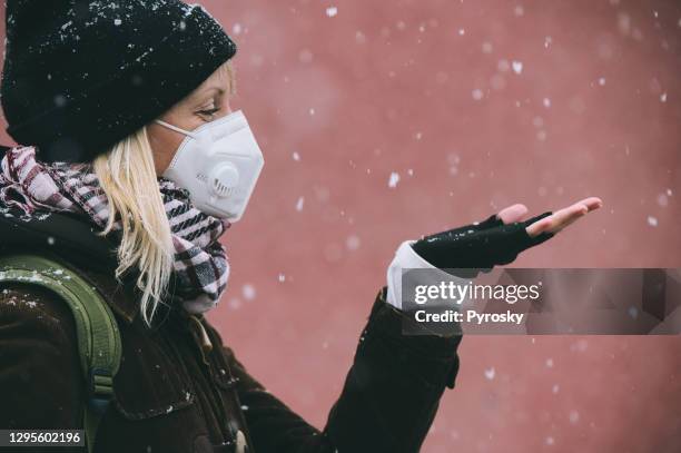 catching snowflakes on the walk - catching snowflakes stock pictures, royalty-free photos & images